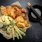 Flat lay of Japanese vegetable tempura recipe with ginger ponzu sauce